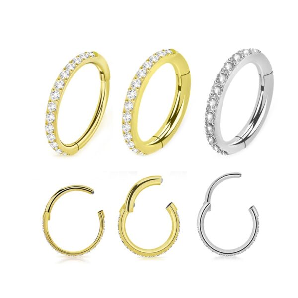 clicker con zirconi frontali in argento che in oro